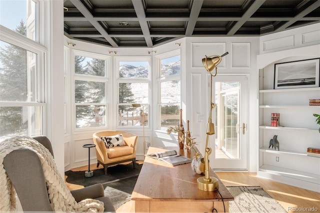 sunroom / solarium with beamed ceiling and coffered ceiling