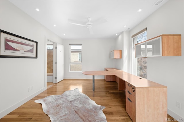 office with light wood-type flooring, a wealth of natural light, baseboards, and recessed lighting