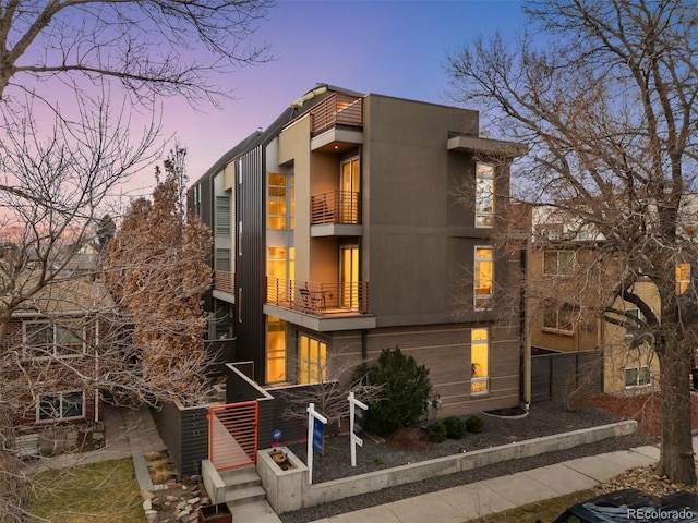 contemporary home with stucco siding