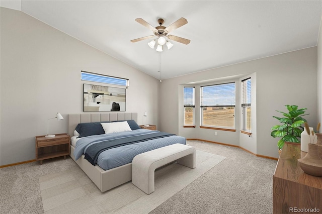 bedroom featuring light carpet, baseboards, vaulted ceiling, and ceiling fan