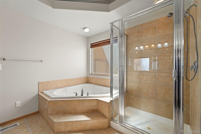 bathroom with a bath, visible vents, tile patterned flooring, and a shower stall