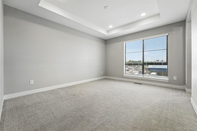2074 S Holly St Unit 2, Denver, CO 80222 - unfurnished room with a tray ceiling, carpet floors, and recessed lighting