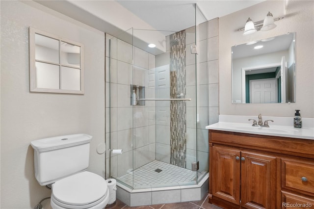 9631 S Dover Way, Littleton, CO 80127 - bathroom featuring a shower stall, toilet, and vanity
