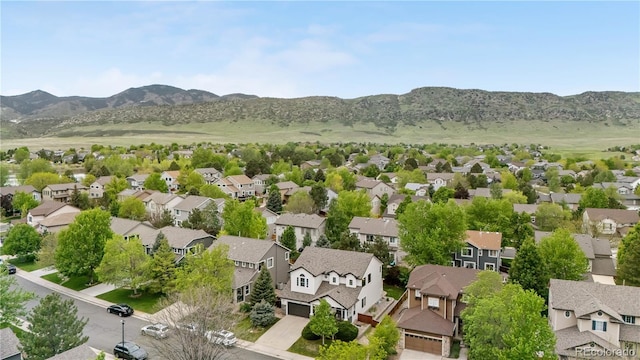 9631 S Dover Way, Littleton, CO 80127 - aerial perspective of suburban area with mountains