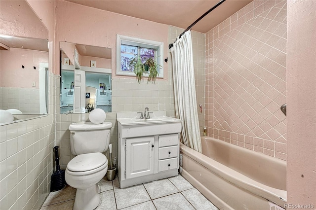 full bathroom featuring shower / tub combo with curtain, tile walls, tile patterned floors, and toilet