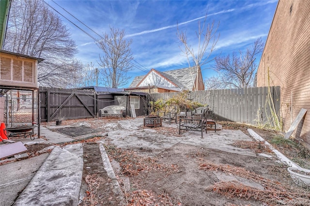 view of yard featuring a fire pit and a patio area