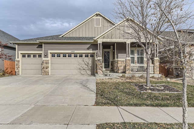 craftsman inspired home with a porch and a garage