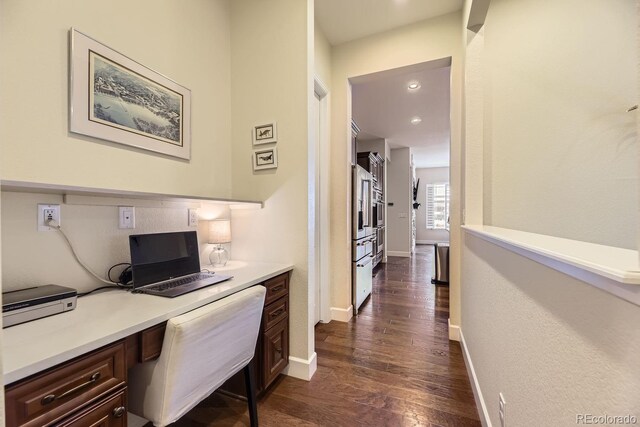 14969 Elsinore Ave, Parker, CO 80134 - office area featuring dark wood-style floors, built in study area, baseboards, and recessed lighting