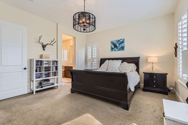 14969 Elsinore Ave, Parker, CO 80134 - bedroom with carpet floors, multiple windows, and ensuite bathroom