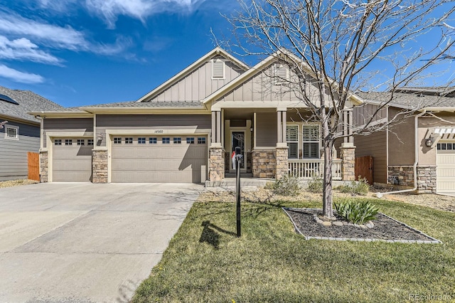 14969 Elsinore Ave, Parker, CO 80134 - craftsman-style house with stone siding, board and batten siding, a porch, and driveway