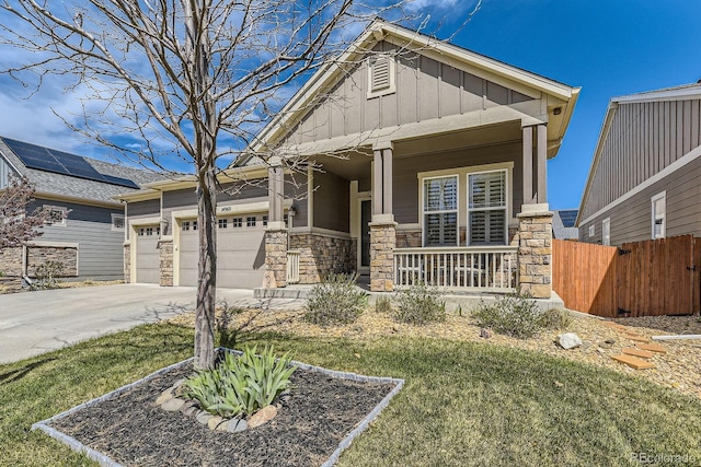 14969 Elsinore Ave, Parker, CO 80134 - craftsman inspired home with covered porch, stone siding, concrete driveway, board and batten siding, and a garage