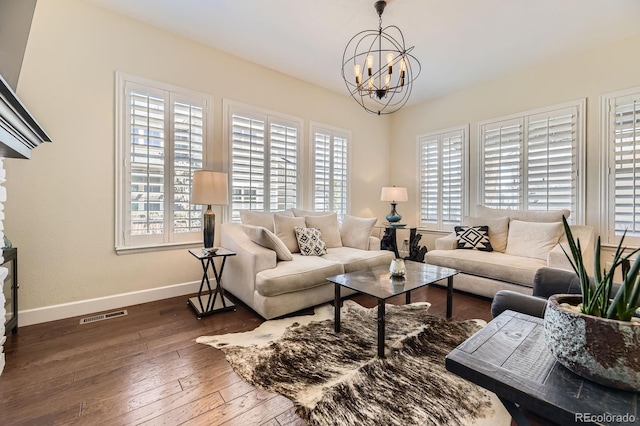 14969 Elsinore Ave, Parker, CO 80134 - living room with plenty of natural light, a chandelier, baseboards, and hardwood / wood-style flooring