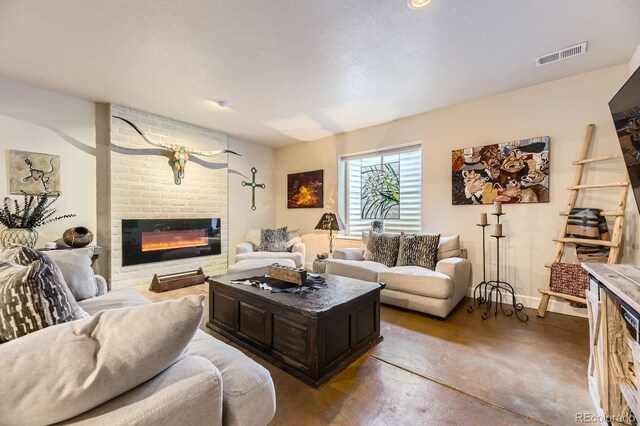 14969 Elsinore Ave, Parker, CO 80134 - living room featuring finished concrete flooring, a brick fireplace, and baseboards
