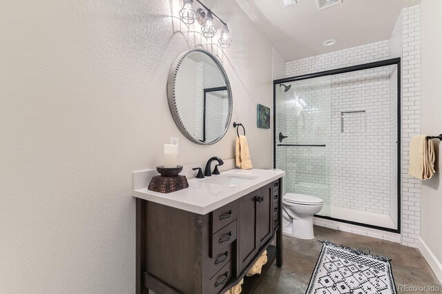 14969 Elsinore Ave, Parker, CO 80134 - bathroom with toilet, vanity, a shower stall, concrete floors, and a textured wall