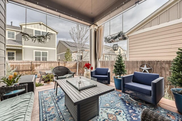 14969 Elsinore Ave, Parker, CO 80134 - fenced backyard featuring an outdoor living space and a patio area
