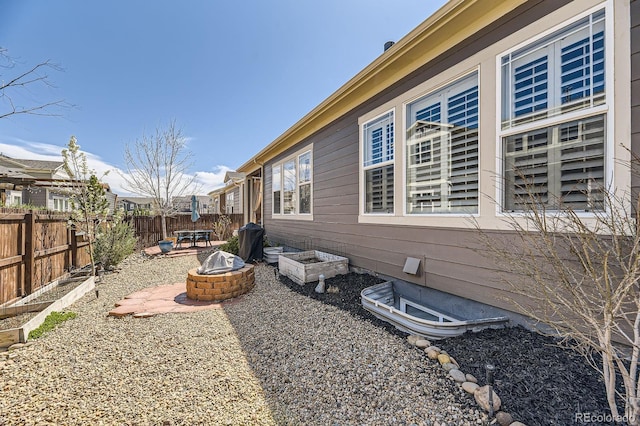14969 Elsinore Ave, Parker, CO 80134 - fenced backyard featuring an outdoor fire pit