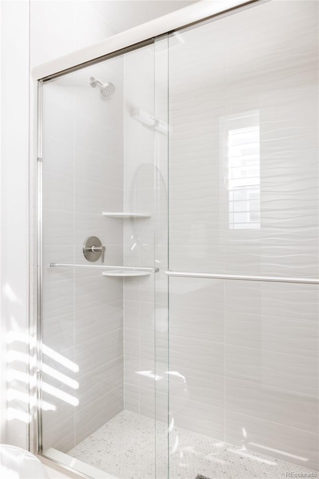 bathroom featuring an enclosed shower