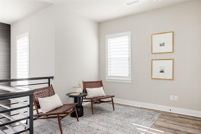 sitting room featuring wood-type flooring