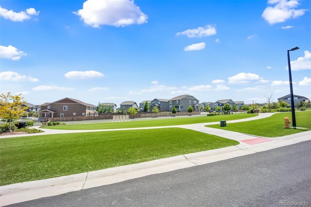 3325 Umber Cir, Castle Rock, CO 80109 - view of asphalt road with a residential view, street lights, and sidewalks