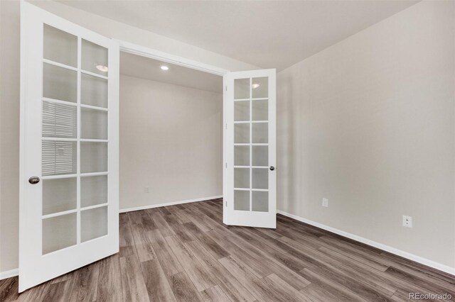 3325 Umber Cir, Castle Rock, CO 80109 - unfurnished room with french doors, wood finished floors, and baseboards