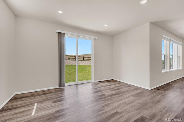 3325 Umber Cir, Castle Rock, CO 80109 - spare room featuring wood finished floors, recessed lighting, and baseboards