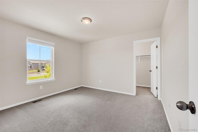 3325 Umber Cir, Castle Rock, CO 80109 - unfurnished bedroom with carpet floors, baseboards, a spacious closet, and a closet