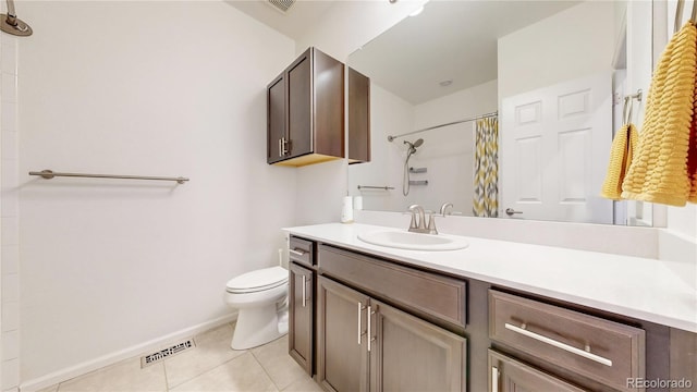 bathroom with vanity, a shower with shower curtain, visible vents, tile patterned floors, and toilet