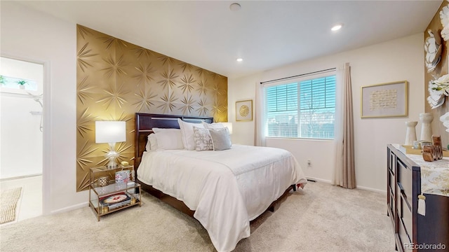 carpeted bedroom featuring recessed lighting, baseboards, an accent wall, and wallpapered walls