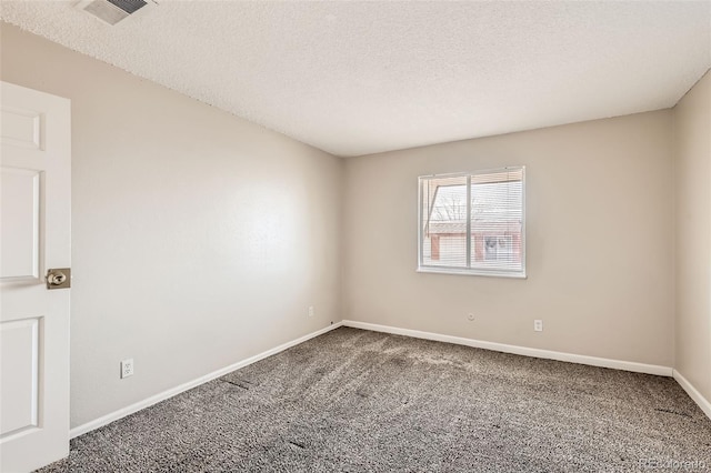 carpeted empty room featuring a textured ceiling, visible vents, and baseboards