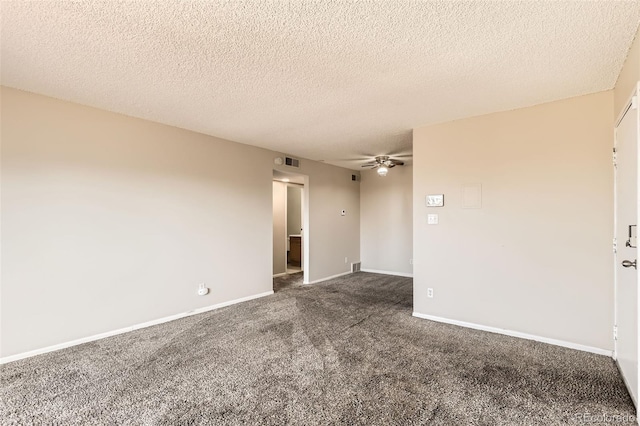 carpeted spare room with visible vents, a textured ceiling, a ceiling fan, and baseboards