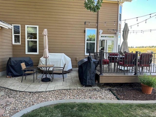 view of patio / terrace with area for grilling and a deck