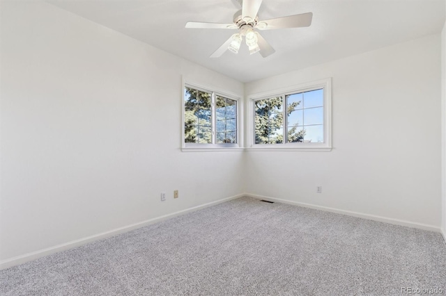 empty room with carpet floors and ceiling fan