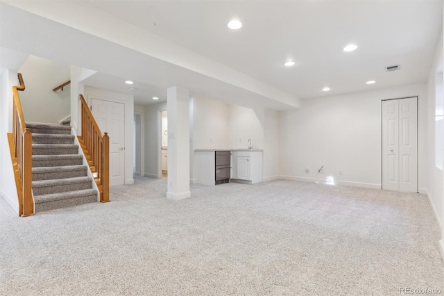 basement with light carpet and sink