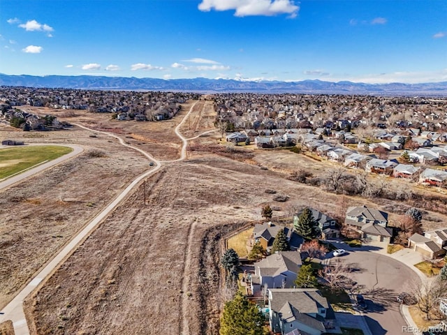 birds eye view of property with a mountain view