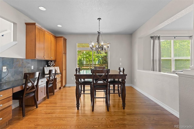 6040 Virgil St, Arvada, CO 80403 - dining area featuring a chandelier, light wood-style flooring, baseboards, and recessed lighting