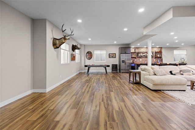 6040 Virgil St, Arvada, CO 80403 - living room with bar, light wood-type flooring, baseboards, and recessed lighting