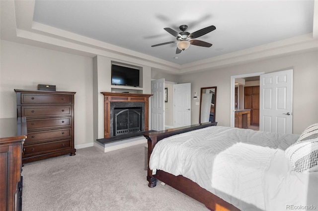 6040 Virgil St, Arvada, CO 80403 - bedroom featuring a raised ceiling, light carpet, a fireplace with raised hearth, a ceiling fan, and baseboards