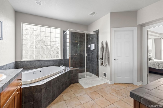6040 Virgil St, Arvada, CO 80403 - ensuite bathroom with a garden tub, healthy amount of natural light, and vanity