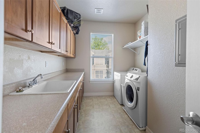 6040 Virgil St, Arvada, CO 80403 - washroom featuring washer and dryer, baseboards, and cabinet space