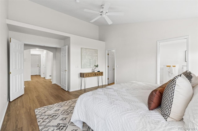 bedroom featuring hardwood / wood-style flooring, ceiling fan, and lofted ceiling