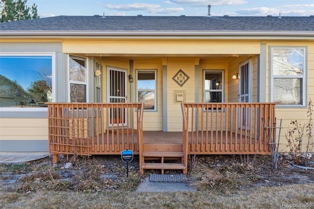 doorway to property with a deck