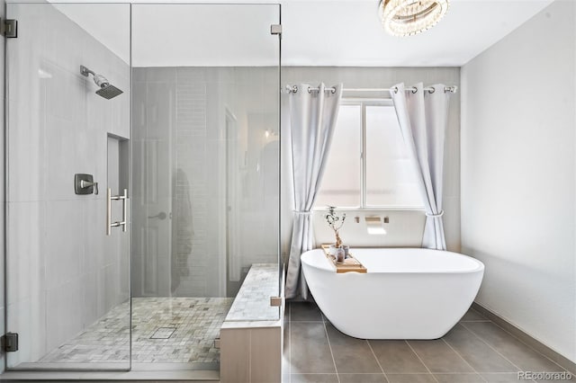 bathroom with tile patterned flooring and independent shower and bath