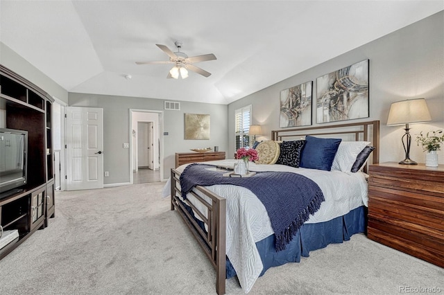 carpeted bedroom featuring ceiling fan and vaulted ceiling