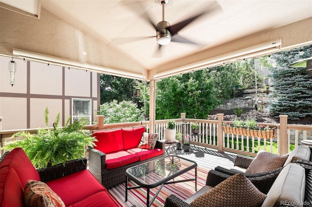 wooden deck featuring an outdoor hangout area and ceiling fan