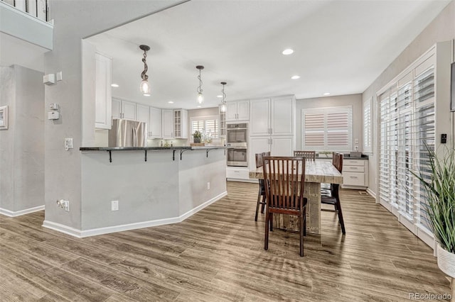 dining room with hardwood / wood-style floors