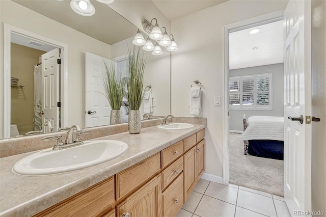 bathroom featuring vanity and tile patterned flooring