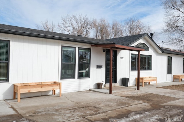 back of house with a patio