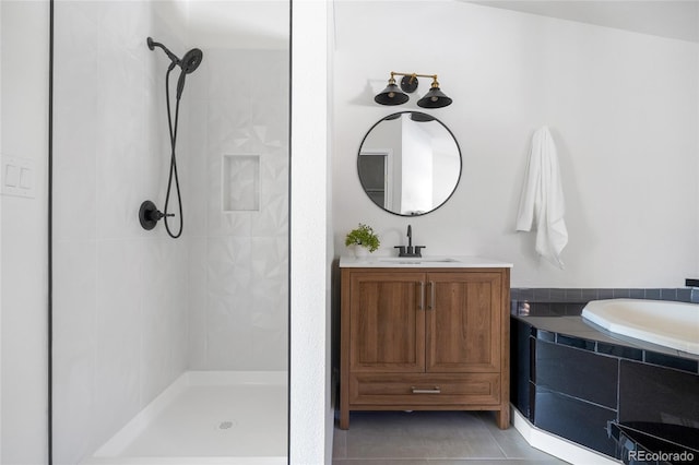 bathroom with independent shower and bath, vanity, and tile patterned floors