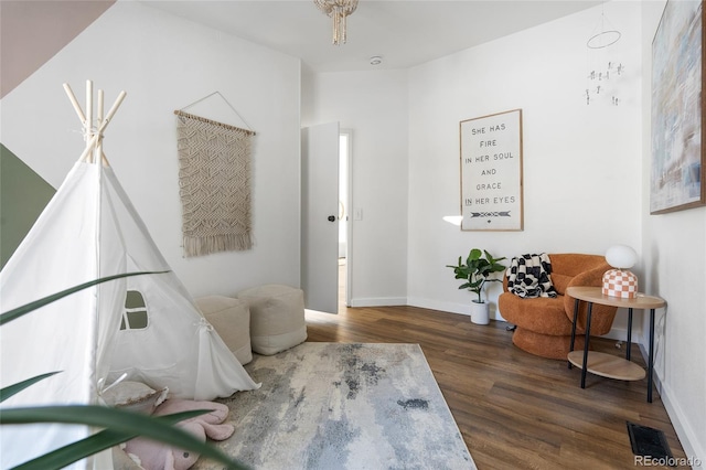 living area with dark hardwood / wood-style floors