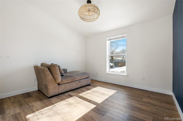 living area with hardwood / wood-style flooring